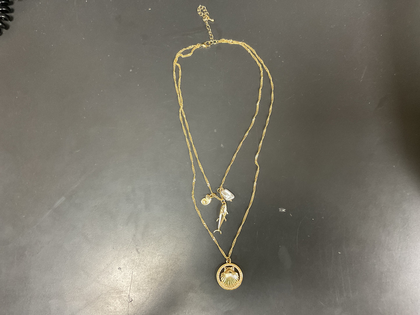 GOLD TWO STRAND NECKLACE WITH FISH & SHELL PENDANTS