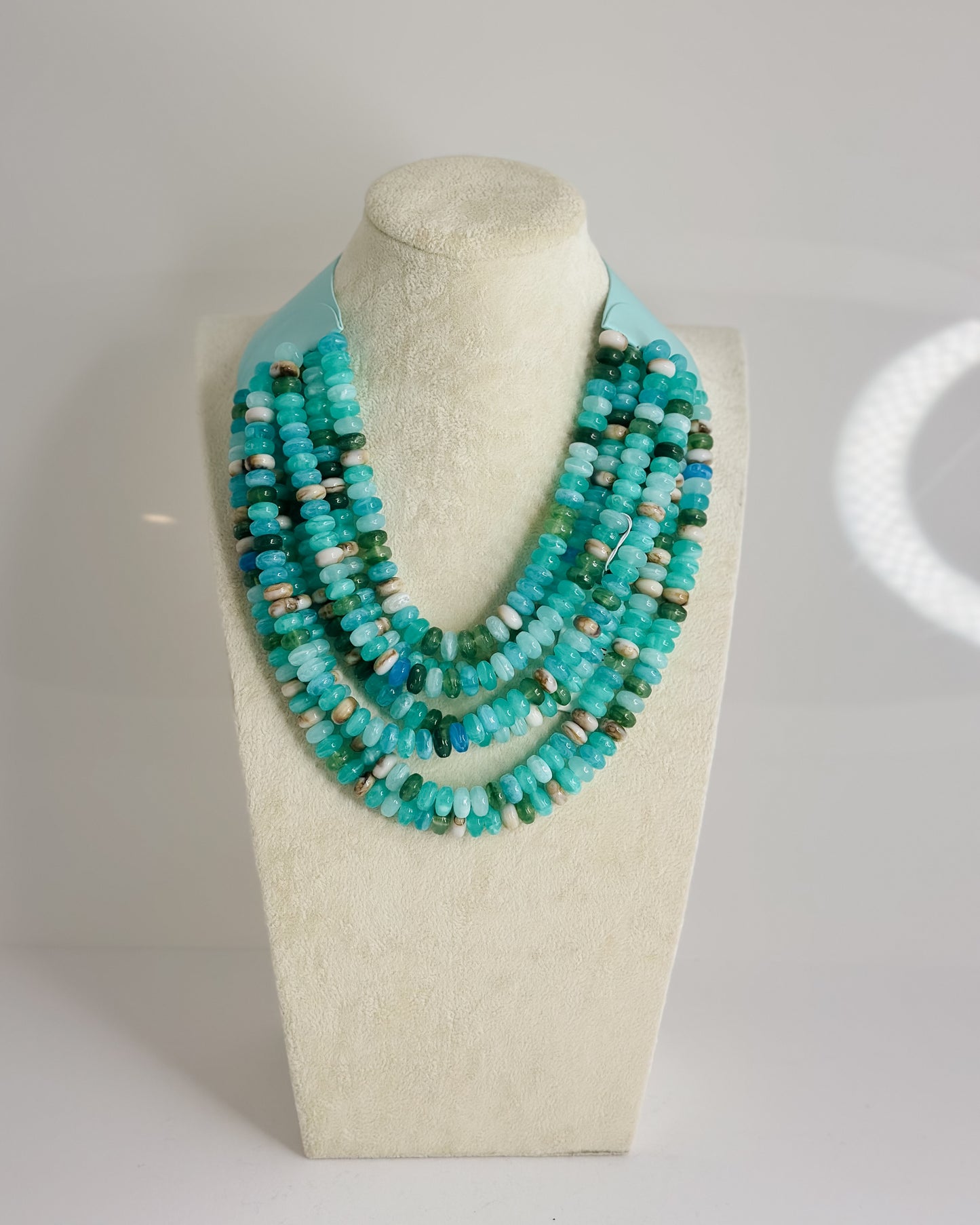 SEVEN STRAND BEADED NECKLACE WITH MAGNETIC CLOSURE
