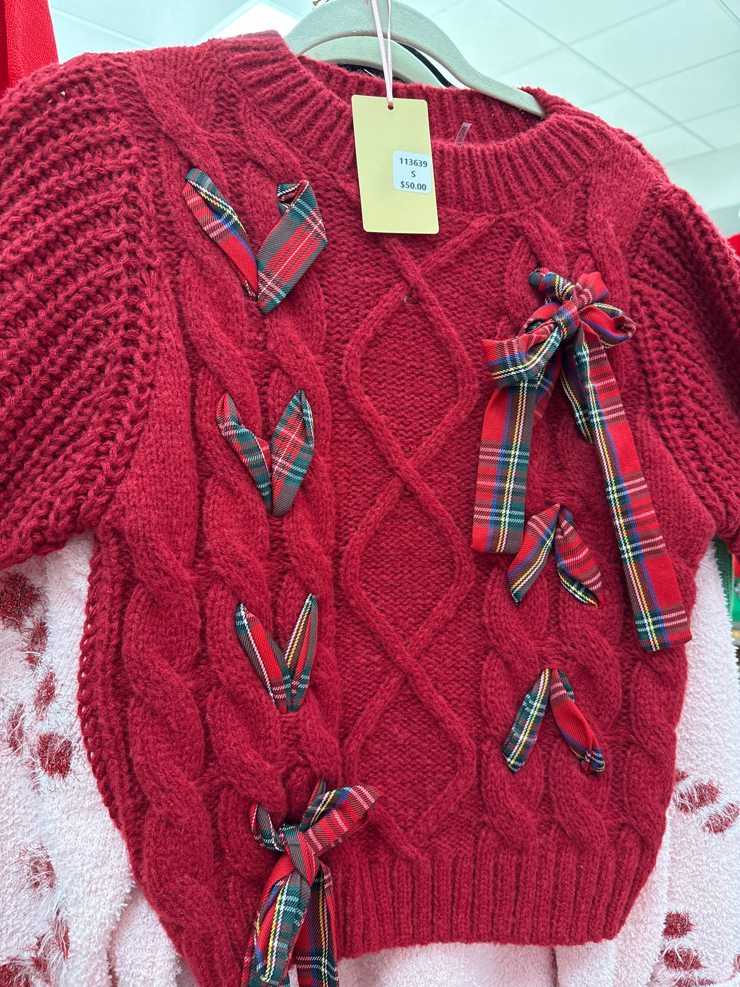 RED SWEATER W/PLAID RIBBON WOVEN THROUGH