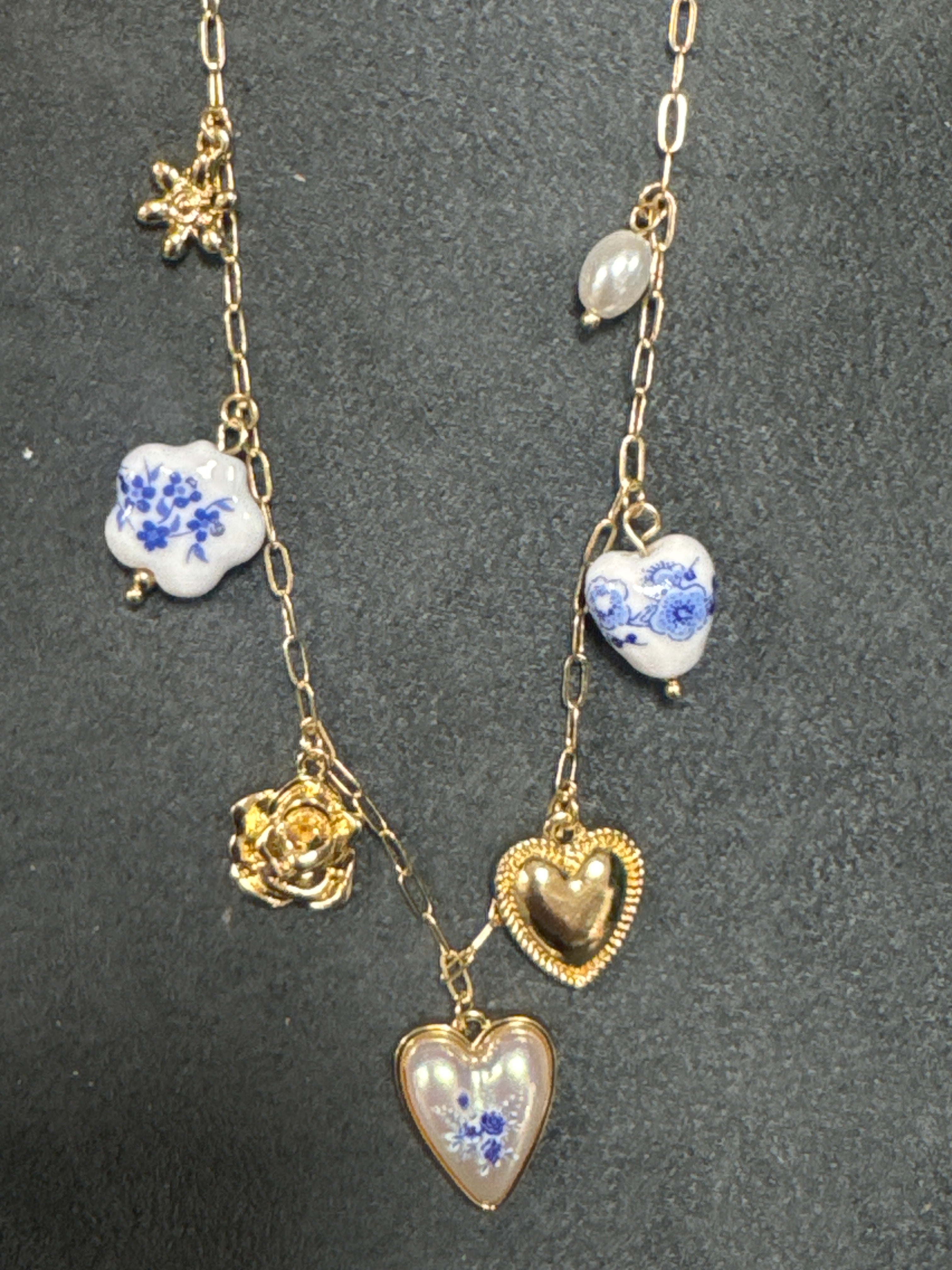 GOLD NECKLACE W/BLUE FLORAL CHARMS