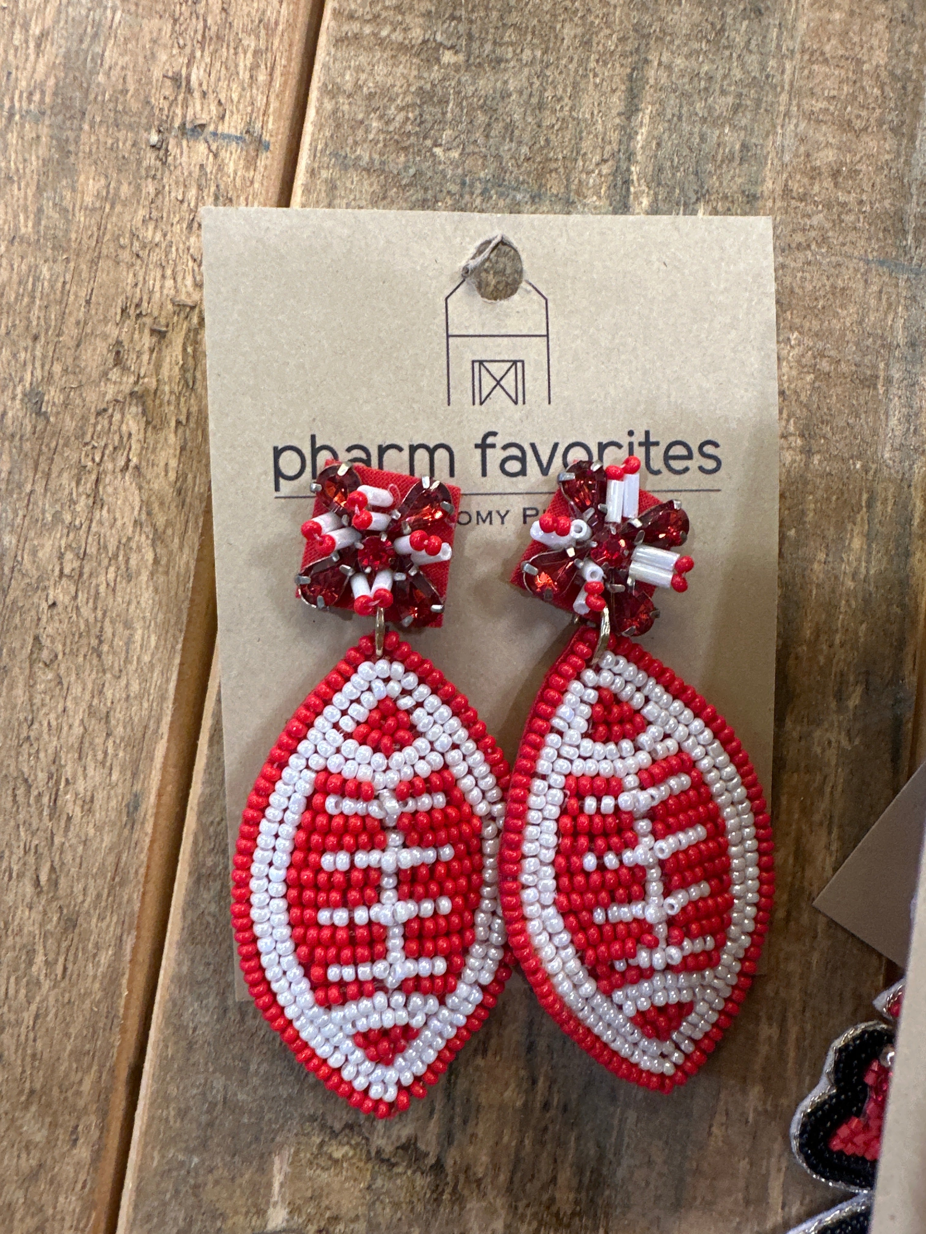 RED AND WHITE BEADED FOOTBALL EARRINGS
