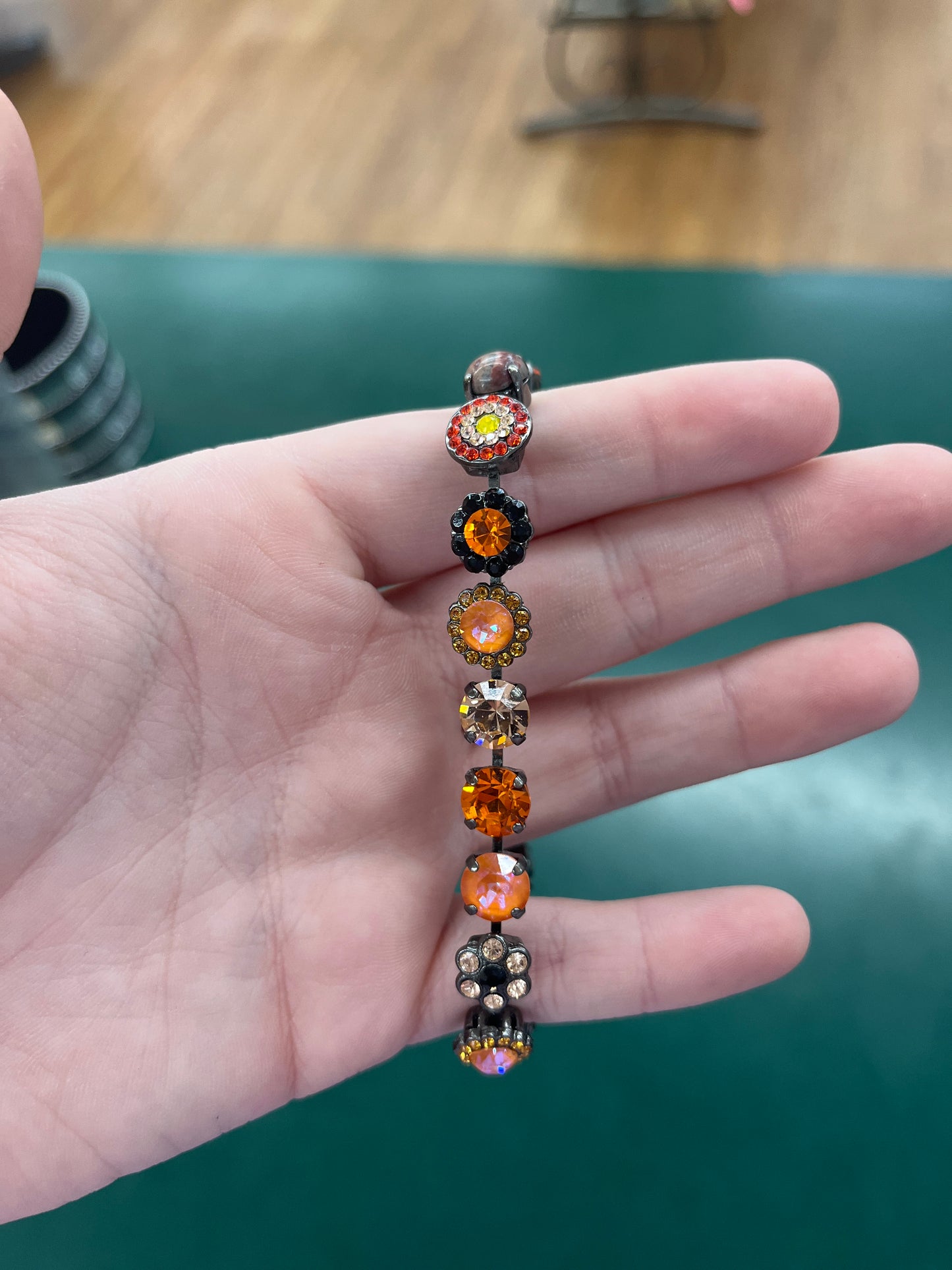 BLK BRCLT ORNG, PEACH, & CHMPGN STONES & FLWRS