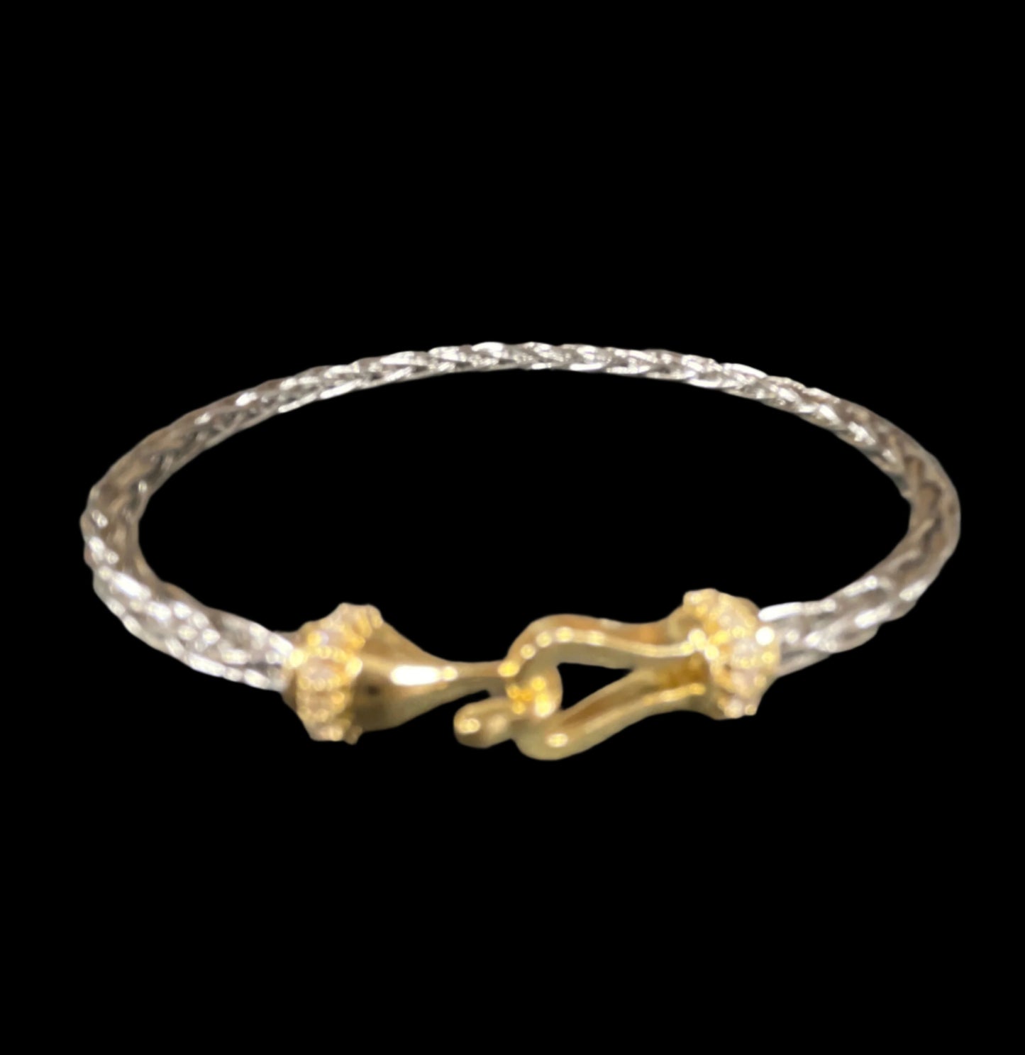 SILVER BRAIDED CABLE CRACELET WITH GOLD HORSE BIT CLOSURE