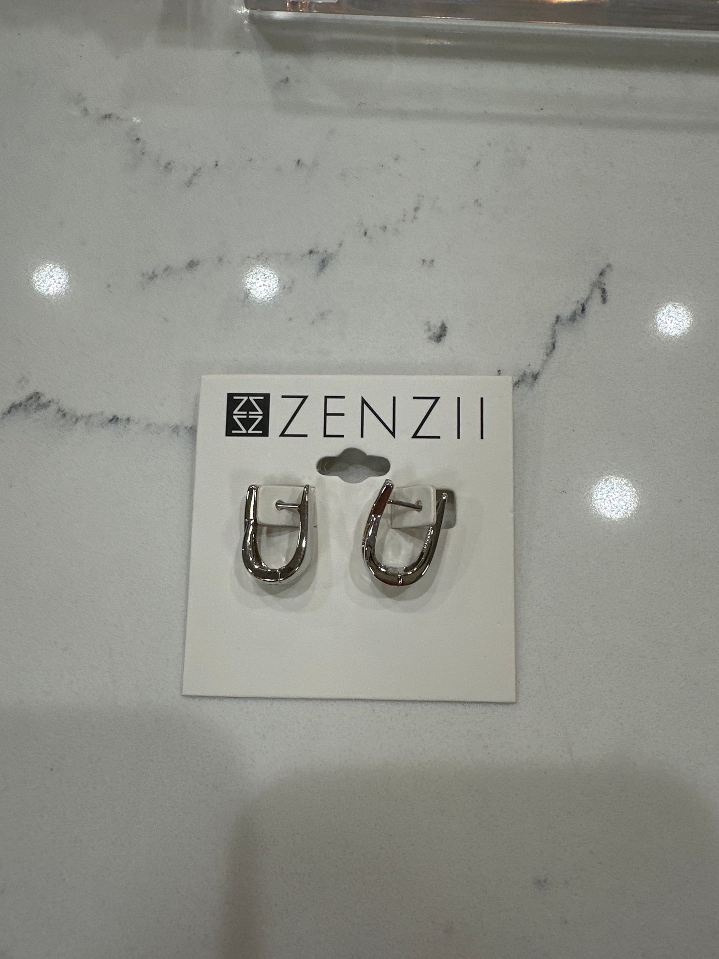 CRISSCROSS HUGGIE EARRINGS - SILVER