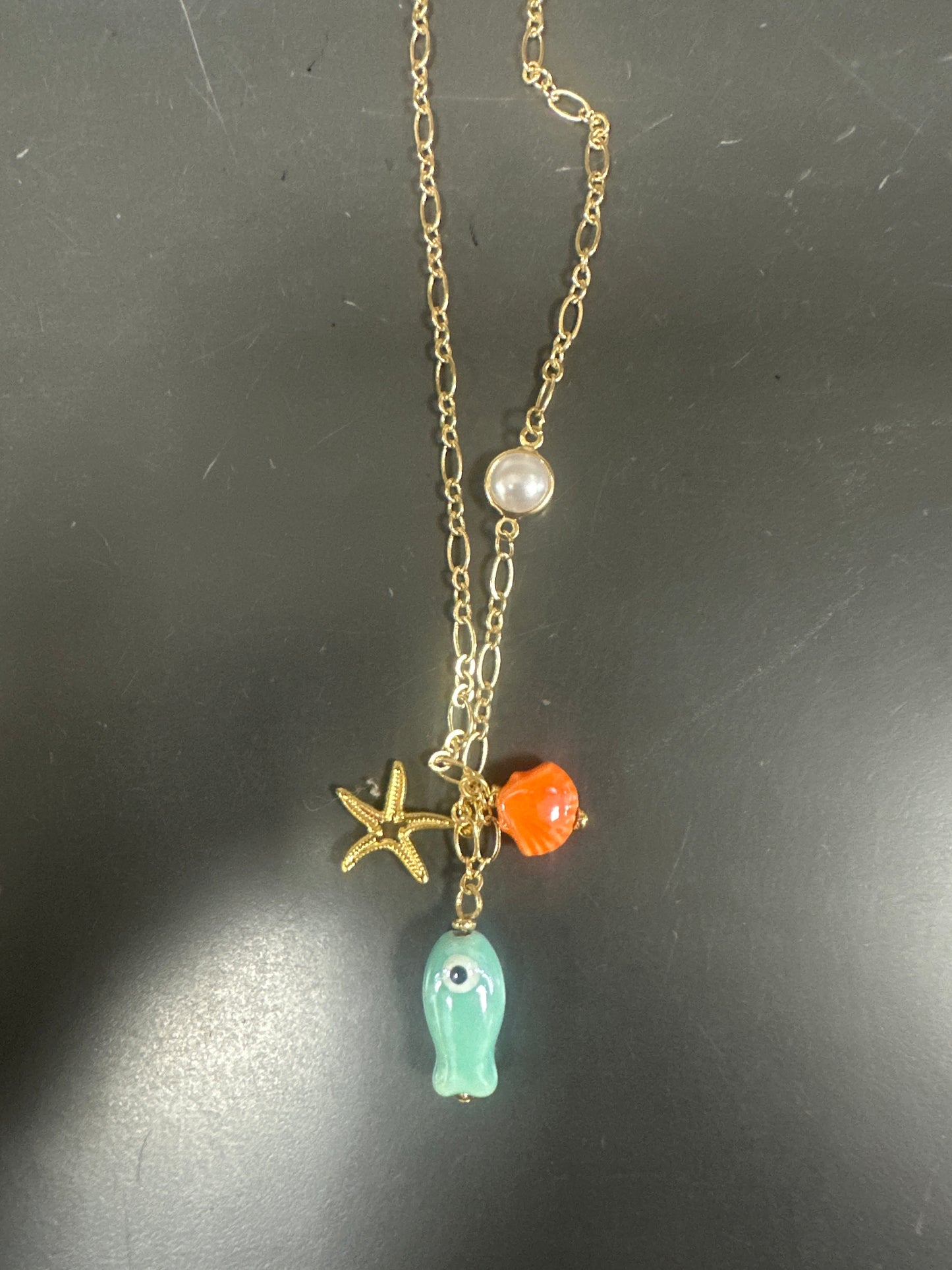 GOLD CHAIN WITH OCEAN THEMED CHARMS