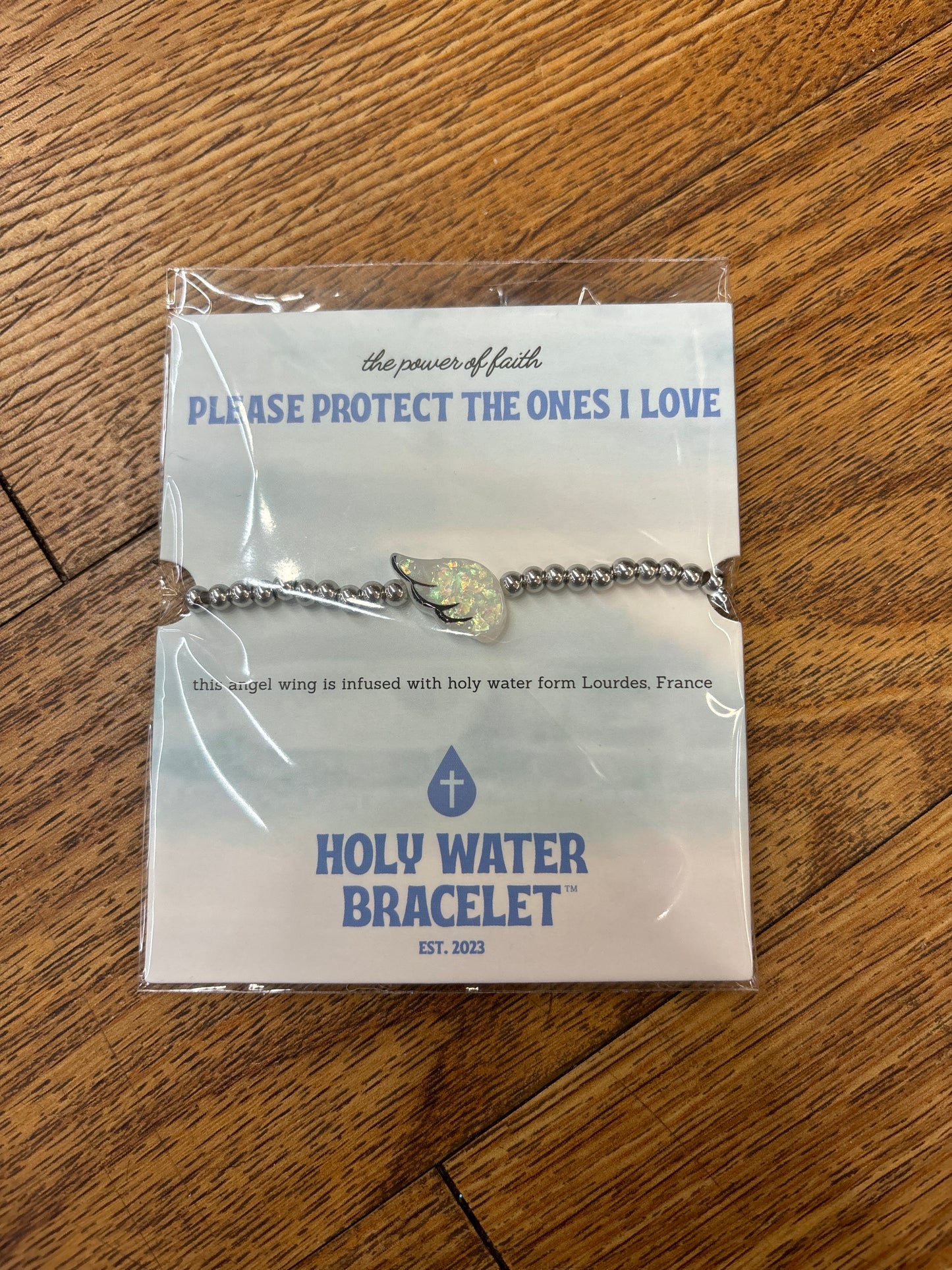 HOLY WATER ANGEL WING BRCLT IN SILVER