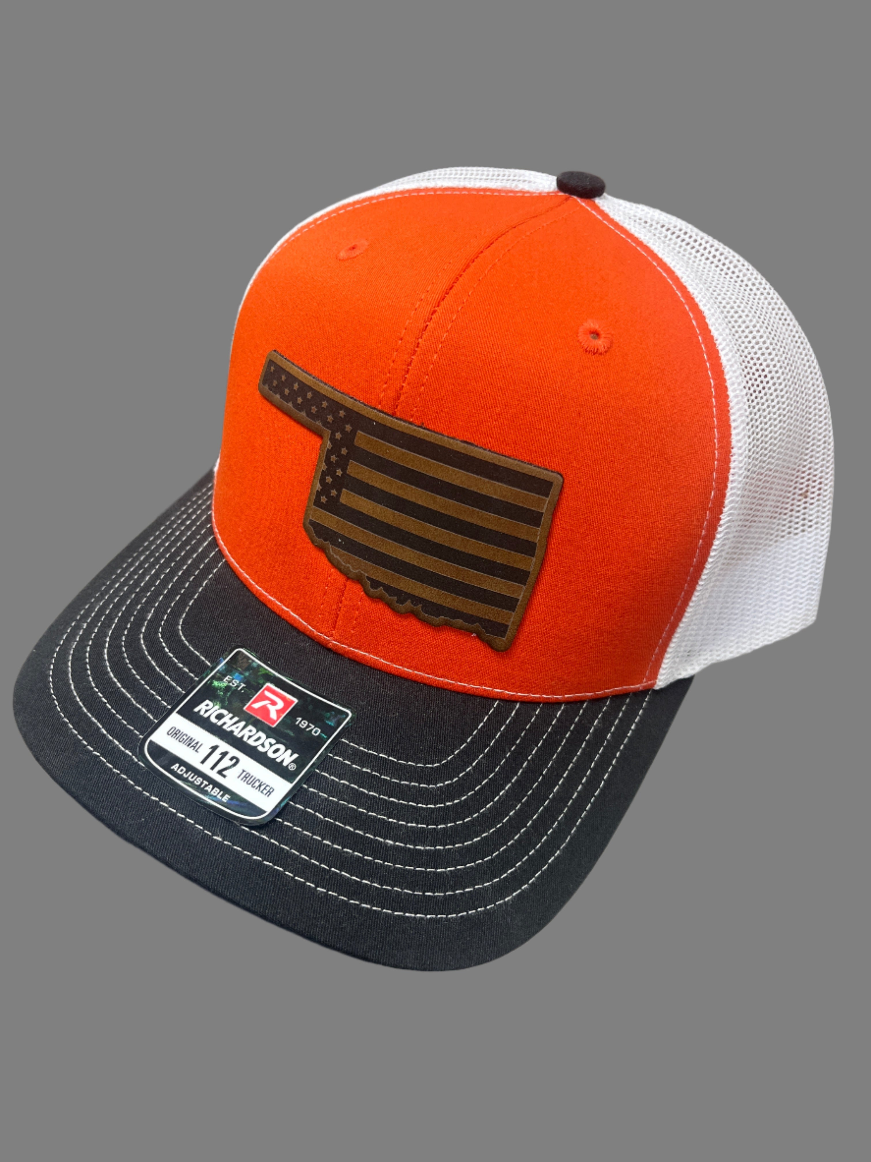 ORANGE/BLACK/WHITE HAT WITH LEATHER FLAG PATCH