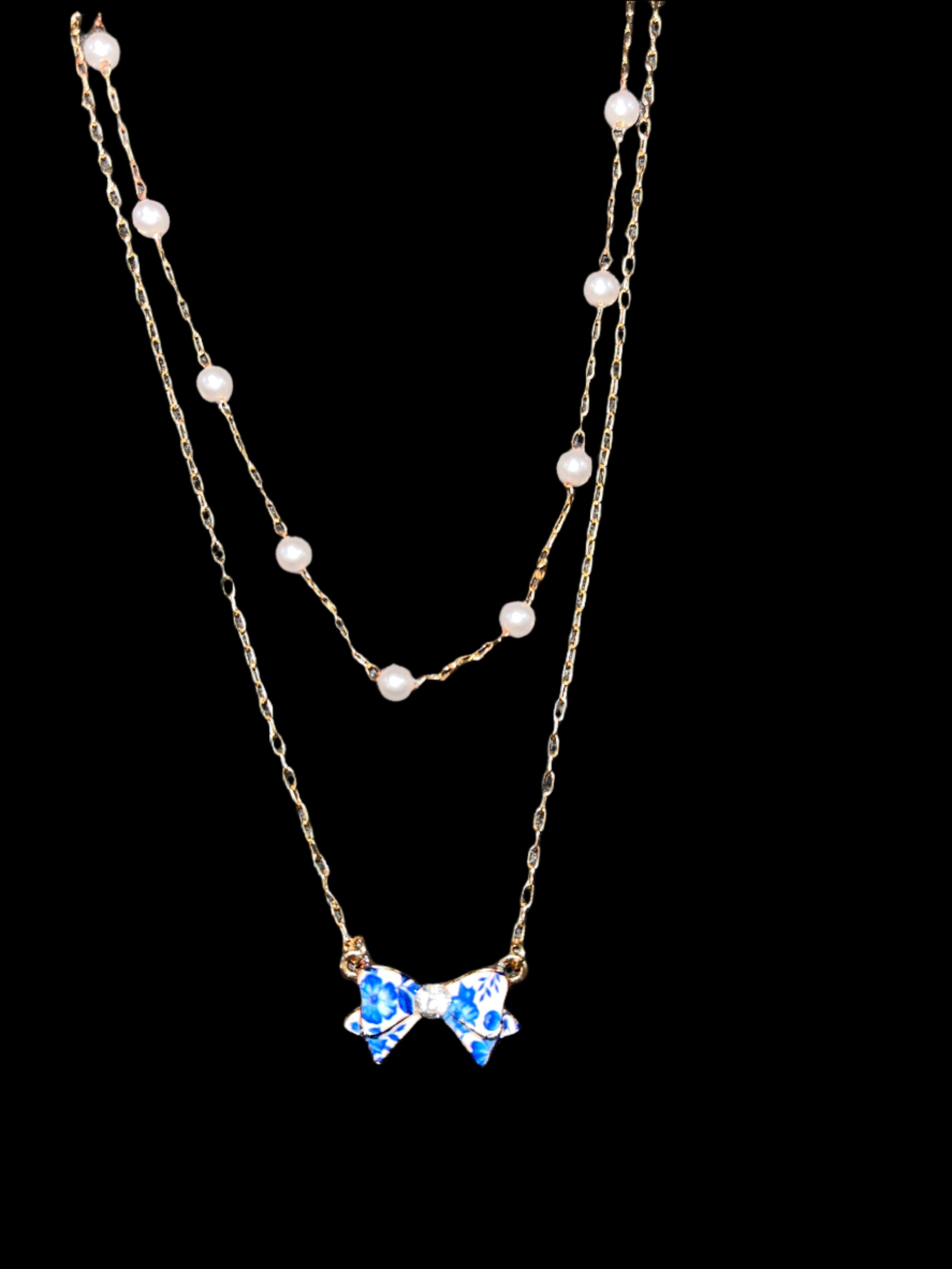 GOLD DOUBLE STRAND NECKLACE WITH PEARLS AND BLUE FLORAL BOW