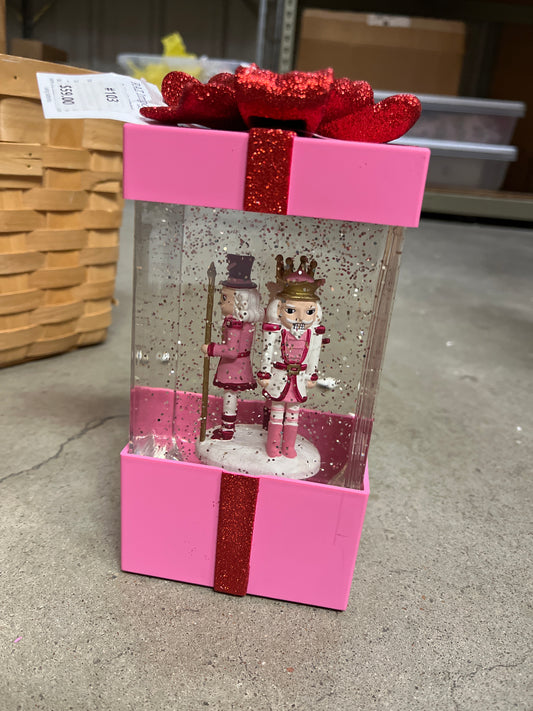 PINK PRESENT GLITTER GLOBE WITH NUTCRACKER