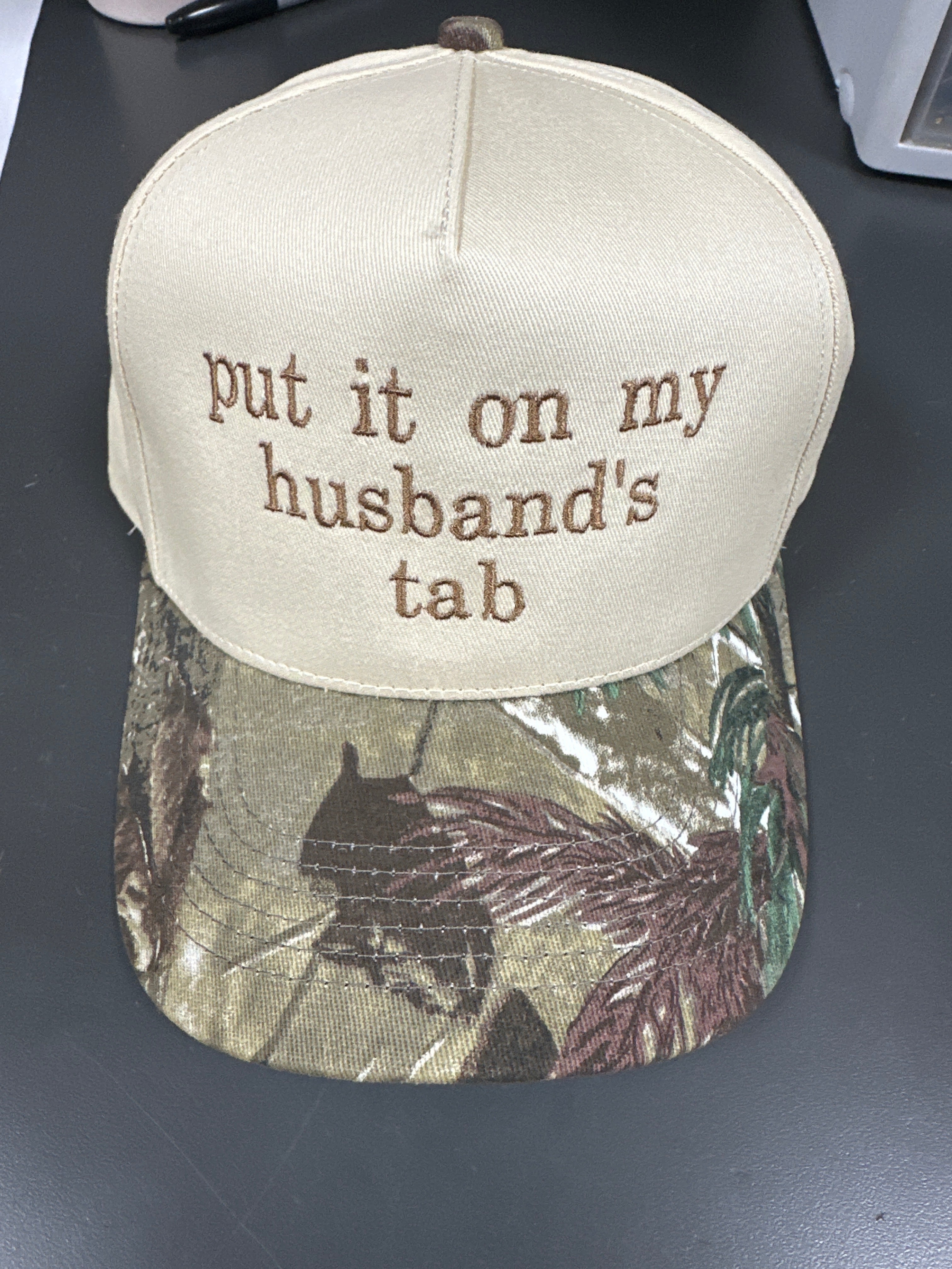 IVORY/CAMO "PUT IT ON MY HUSBAND'S TAB" HAT