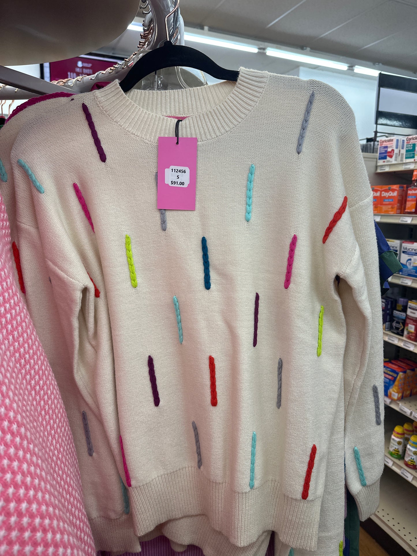 CREAM SWEATER W/MULTI KNOTTED DETAILS - L