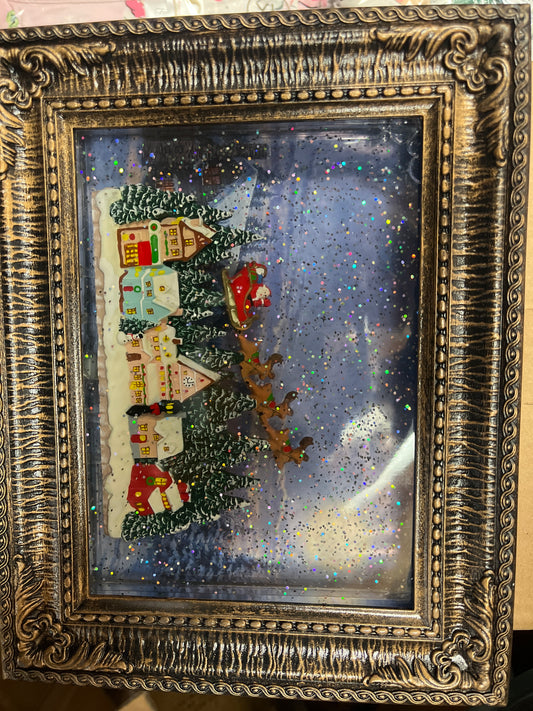 SANTA TAKES FLIGHT GLITTER WATER PICTURE