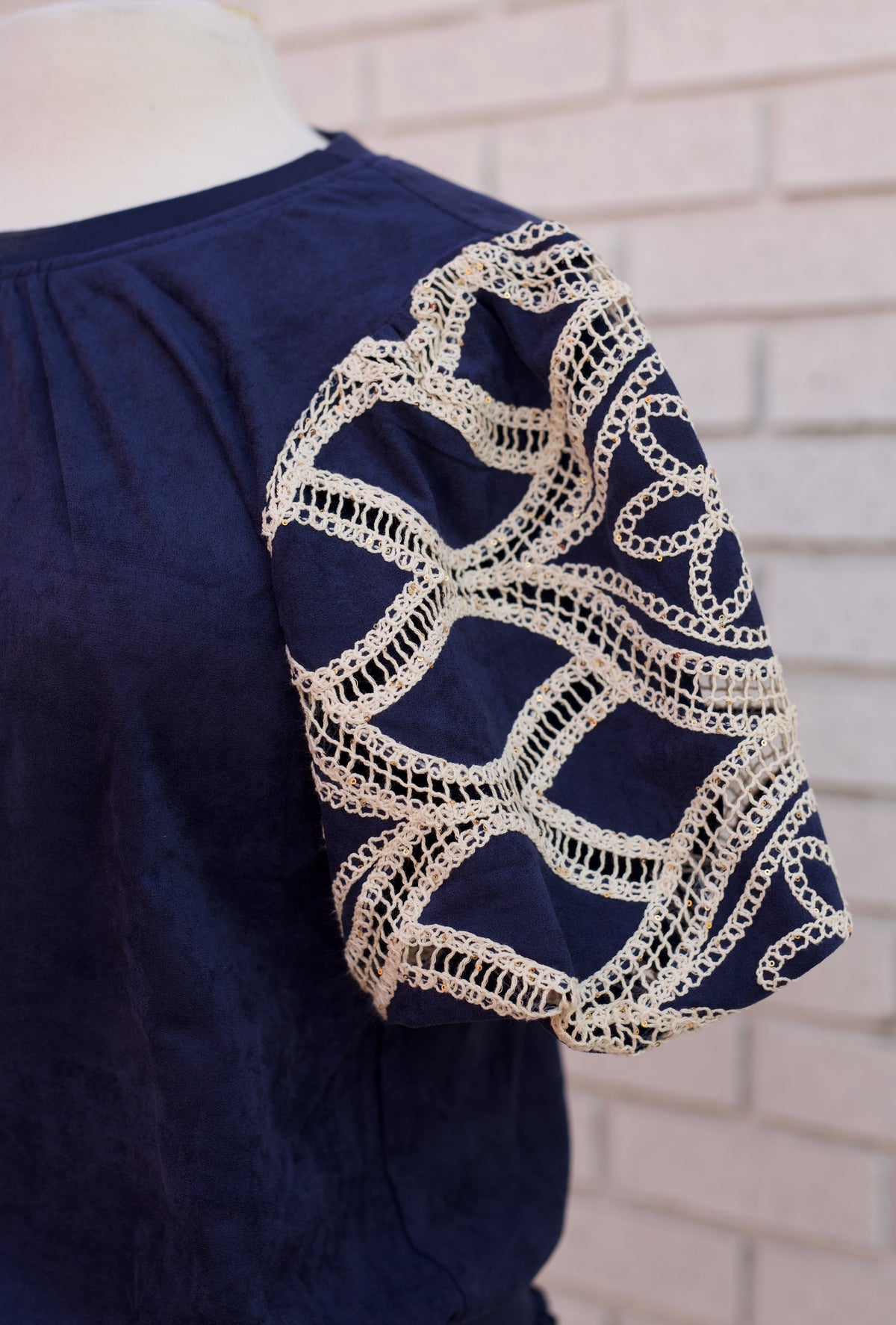 FLORAL EYELET CROCHET BUBBLE SLEEVE SUEDE TOP