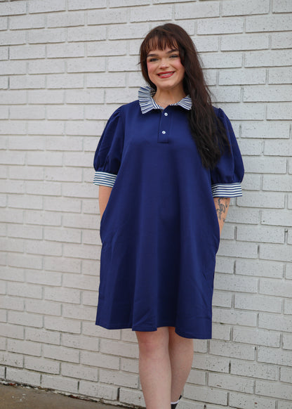 NAVY SHORT SLEEVE POLO DRESS WITH STRIPE CONTRAST RUFFLE COLLAR AND SLEEVE TRIM