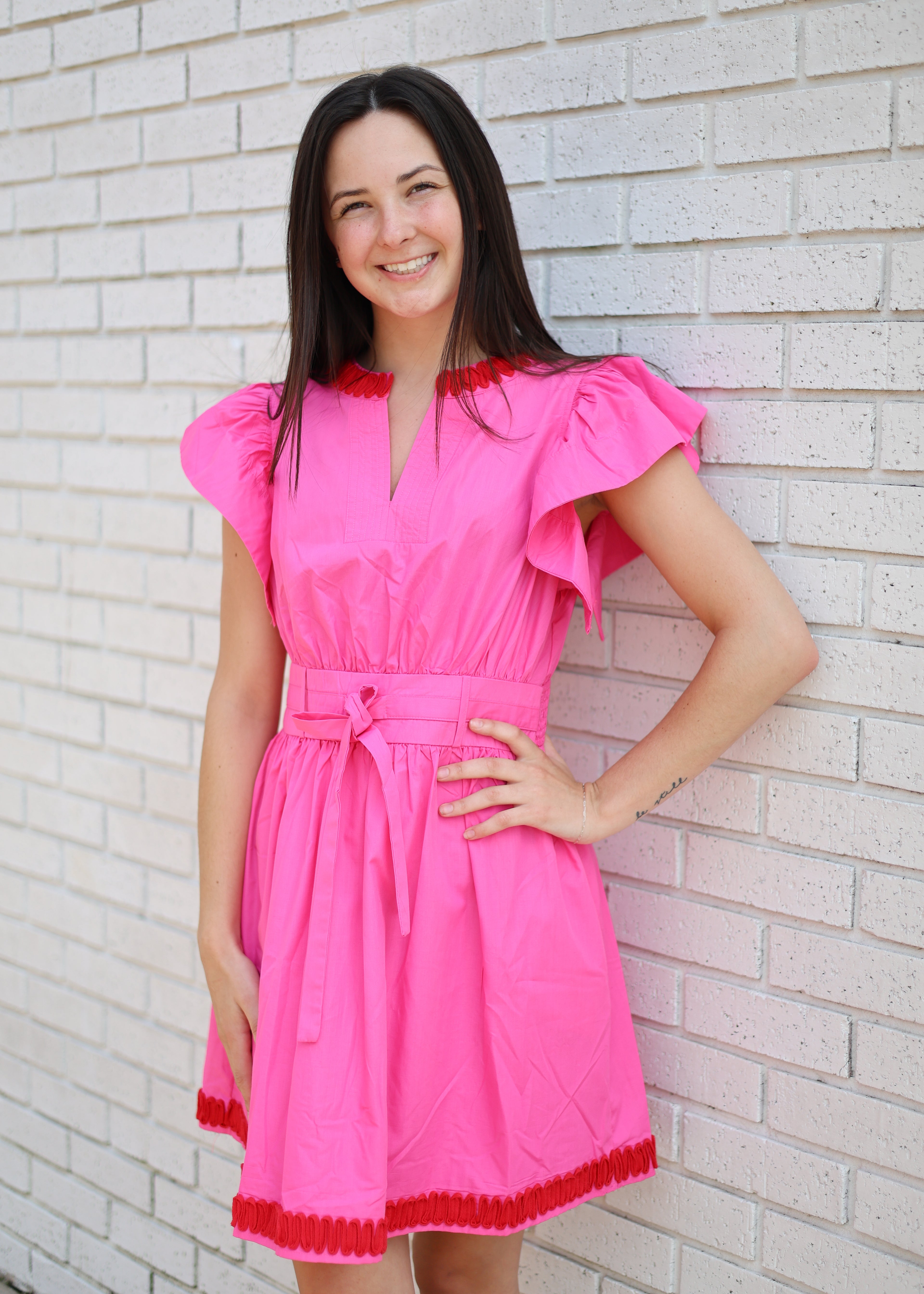 HOT PINK FLUTTER SLEEVE DRESS WITH RED WAVE PATTERN APPLIQUE TRIM