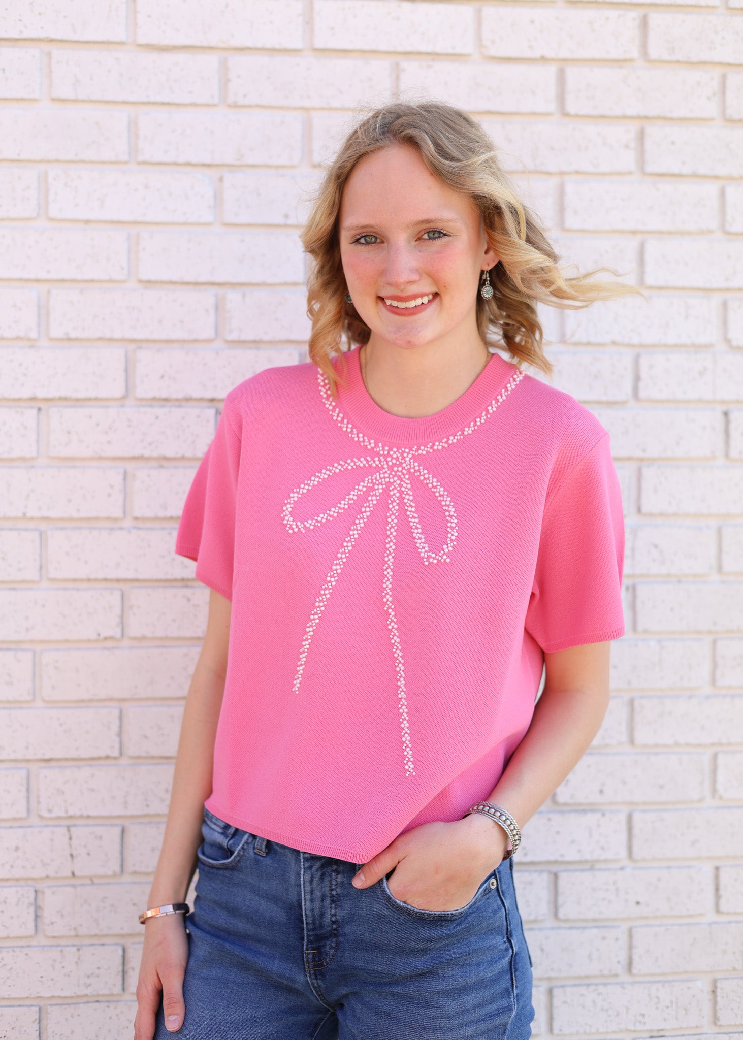 PINK TOP WITH BEADED BOW EMBELLISHMENT
