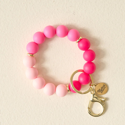 HANDS-FREE KEYCHAIN WRISTLET - TICKLED PINK - Pharm Favorites by Economy Pharmacy