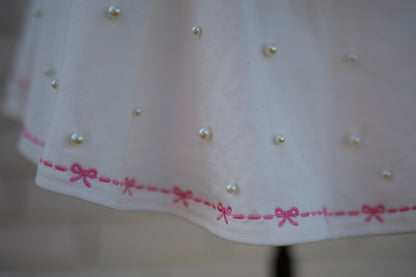 WHITE SKORT W/PEARL & PINK BOW DETAIL